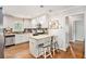 Modern kitchen featuring granite countertops, stainless steel appliances, and an island with seating for two at 2779 Fairlee Dr, Decatur, GA 30032