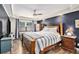 Main bedroom with a tray ceiling, hardwood flooring, and natural light from the window at 2779 Fairlee Dr, Decatur, GA 30032