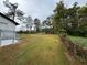 A large sloping backyard, enclosed with a chainlink fence at 3078 Michael Sw Dr, Marietta, GA 30060