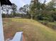 A sloping backyard with a chain link fence in the rear of the property at 3078 Michael Sw Dr, Marietta, GA 30060