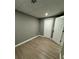 Finished basement area featuring neutral paint colors and vinyl wood flooring throughout at 3078 Michael Sw Dr, Marietta, GA 30060