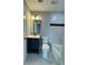 Charming bathroom featuring a vanity sink and a tiled bathtub with a shower at 3078 Michael Sw Dr, Marietta, GA 30060
