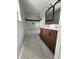 Modern bathroom featuring double vanity with wood cabinets, bathtub and stylish tile floor at 3078 Michael Sw Dr, Marietta, GA 30060
