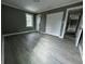 Bedroom featuring neutral walls, updated flooring, double-door closet, and natural light at 3078 Michael Sw Dr, Marietta, GA 30060
