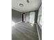 Cozy bedroom with wood-look flooring, gray walls, and white sliding closet door at 3078 Michael Sw Dr, Marietta, GA 30060