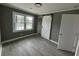 Cozy bedroom featuring light gray walls and a white sliding closet door at 3078 Michael Sw Dr, Marietta, GA 30060