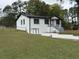 Exterior view of this renovated home, featuring white painted brick at 3078 Michael Sw Dr, Marietta, GA 30060