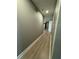 Basement hallway with wood-look flooring and access to rooms at 3078 Michael Sw Dr, Marietta, GA 30060