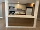 This home features a neutral toned kitchen with a breakfast bar and wood plank flooring at 3078 Michael Sw Dr, Marietta, GA 30060