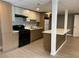 This home features a neutral toned kitchen with a breakfast bar and wood plank flooring at 3078 Michael Sw Dr, Marietta, GA 30060