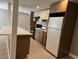 This home features a neutral toned kitchen with a breakfast bar and wood plank flooring at 3078 Michael Sw Dr, Marietta, GA 30060