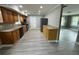 Well-lit kitchen featuring stainless steel appliances, wood cabinets, and sleek gray flooring at 3078 Michael Sw Dr, Marietta, GA 30060
