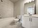 Clean bathroom with shower/tub combo and white vanity at 3154 Rosebud Rd, Loganville, GA 30052