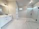 Bright bathroom featuring a glass-enclosed shower and a vanity at 3154 Rosebud Rd, Loganville, GA 30052