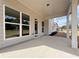 Covered patio with concrete flooring and white columns offering a relaxing outdoor space at 3154 Rosebud Rd, Loganville, GA 30052