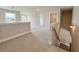 Hallway with carpet, white walls, and staircase at 3154 Rosebud Rd, Loganville, GA 30052