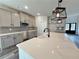 Modern kitchen features quartz countertops, stainless steel appliances, and modern lighting fixtures at 3154 Rosebud Rd, Loganville, GA 30052
