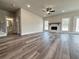Open-concept living room with fireplace, large windows, and lots of space at 3154 Rosebud Rd, Loganville, GA 30052