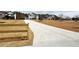 View of neighborhood street with well-maintained lawns and new construction homes in a desirable community at 3154 Rosebud Rd, Loganville, GA 30052