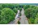 Aerial view showcasing a neighborhood with lush greenery and tree-lined streets at 5400 Roswell Rd # N1, Sandy Springs, GA 30342