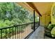Spacious balcony with outdoor seating offering a serene view of the surrounding greenery at 5400 Roswell Rd # N1, Sandy Springs, GA 30342