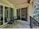 Cozy balcony with outdoor seating and sliding glass doors leading inside at 5400 Roswell Rd # N1, Sandy Springs, GA 30342