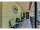 Brick balcony with seating and leafy view at 5400 Roswell Rd # N1, Sandy Springs, GA 30342