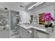 Bathroom featuring a vanity with marble countertop, a large mirror, and a glass enclosed shower at 5400 Roswell Rd # N1, Sandy Springs, GA 30342