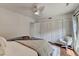Bright bedroom featuring a ceiling fan, hardwood floors, and spacious closets at 5400 Roswell Rd # N1, Sandy Springs, GA 30342