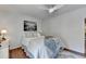 Cozy bedroom showcasing light wood floors, ceiling fan, and a neutral color scheme at 5400 Roswell Rd # N1, Sandy Springs, GA 30342