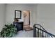Entryway featuring a staircase, decorative mirror, plant, and black cabinet at 5400 Roswell Rd # N1, Sandy Springs, GA 30342