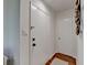 Entryway with a white door and hardwood floors, light switch, and decorative orbs at 5400 Roswell Rd # N1, Sandy Springs, GA 30342