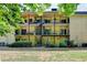 Apartment Building showing balconies and spiral staircases surrounded by trees at 5400 Roswell Rd # N1, Sandy Springs, GA 30342