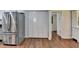Open kitchen featuring a stainless steel refrigerator and pantry at 5400 Roswell Rd # N1, Sandy Springs, GA 30342