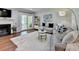 Bright living room with hardwood floors, a fireplace, and a glass door to a balcony at 5400 Roswell Rd # N1, Sandy Springs, GA 30342