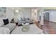 Living room view showcasing hardwood floors, neutral tones, and a glimpse of the kitchen at 5400 Roswell Rd # N1, Sandy Springs, GA 30342