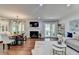 Open-concept living room and dining area with hardwood floors, fireplace, and modern decor at 5400 Roswell Rd # N1, Sandy Springs, GA 30342