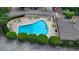Aerial view of a fenced community pool with lounge chairs and people enjoying the water at 5400 Roswell Rd # N1, Sandy Springs, GA 30342