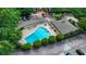 Aerial view of a fenced community pool with lounge chairs, and a manicured landscape at 5400 Roswell Rd # N1, Sandy Springs, GA 30342