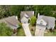Aerial view of well-maintained homes with manicured lawns, driveways, and mature trees surrounding the properties at 230 Ridge Point Ct, Alpharetta, GA 30022