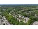 An aerial view showcasing the neighborhood homes nestled among lush greenery and mature trees at 230 Ridge Point Ct, Alpharetta, GA 30022