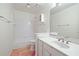 Bright bathroom with a white vanity, large mirror, and a combined tub and shower at 230 Ridge Point Ct, Alpharetta, GA 30022