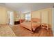 Bright bedroom with a four-poster bed, wood floors and a sunny, welcoming feel at 230 Ridge Point Ct, Alpharetta, GA 30022