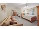 Cozy bedroom with a couch, queen bed, mirrored closet and a serene, inviting atmosphere at 230 Ridge Point Ct, Alpharetta, GA 30022