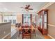 Inviting dining area with natural light, wood furniture, and a ceiling fan at 230 Ridge Point Ct, Alpharetta, GA 30022