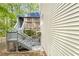 Exterior view of a two-story house with a large upper and lower back porch and wood plank siding at 230 Ridge Point Ct, Alpharetta, GA 30022