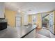 Compact kitchen features laminate countertops, white appliances, and an exterior entrance with a garden view at 230 Ridge Point Ct, Alpharetta, GA 30022