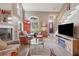 Bright living room with a cozy fireplace, hardwood floors, and staircase at 230 Ridge Point Ct, Alpharetta, GA 30022