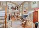 Open living room with high ceilings, a fireplace, large windows, and natural light at 230 Ridge Point Ct, Alpharetta, GA 30022