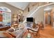 Spacious living room with tall ceilings, open staircase, hardwood floors, and large windows at 230 Ridge Point Ct, Alpharetta, GA 30022